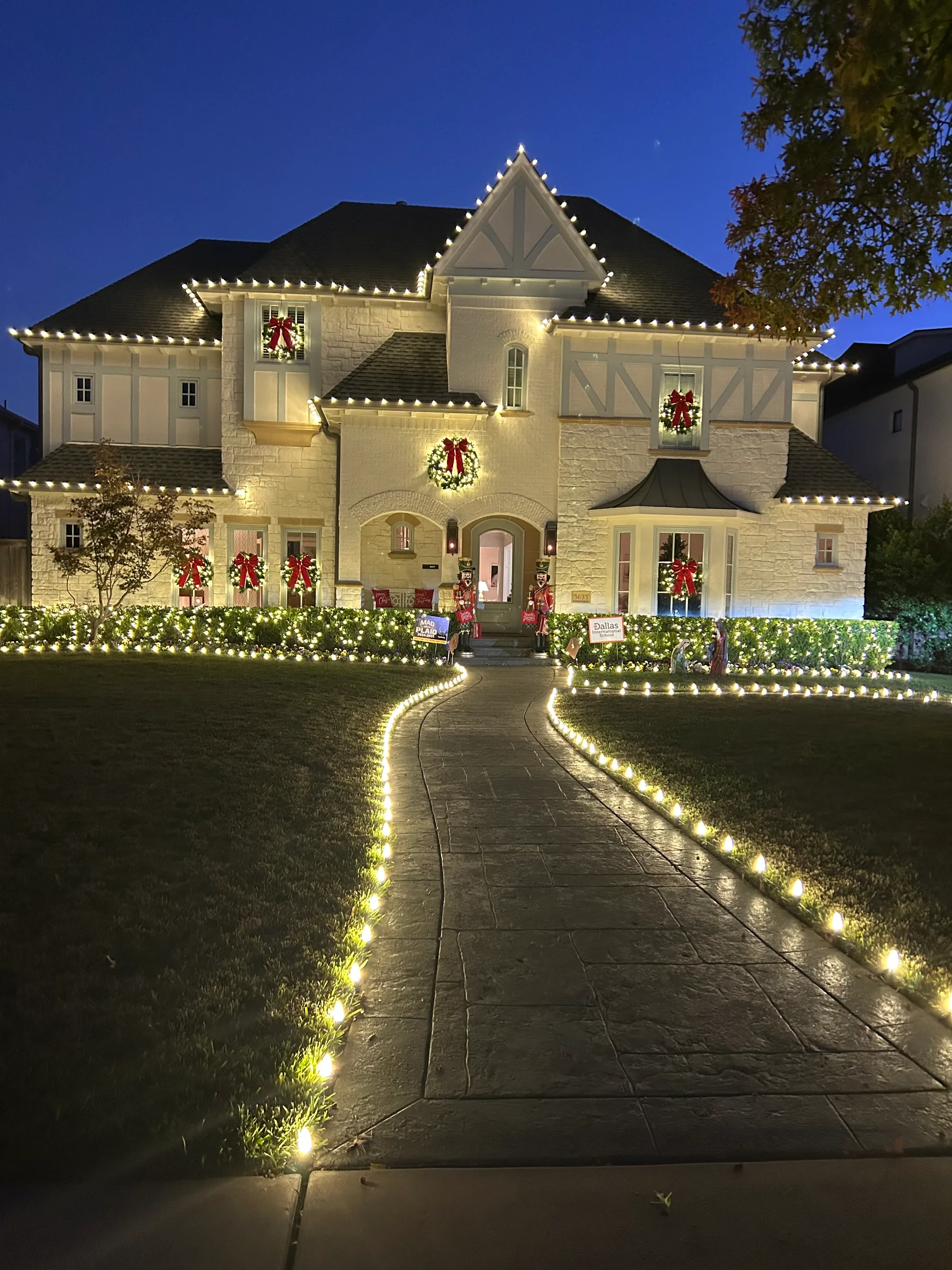 Warm white roofline and front walk for Christmas